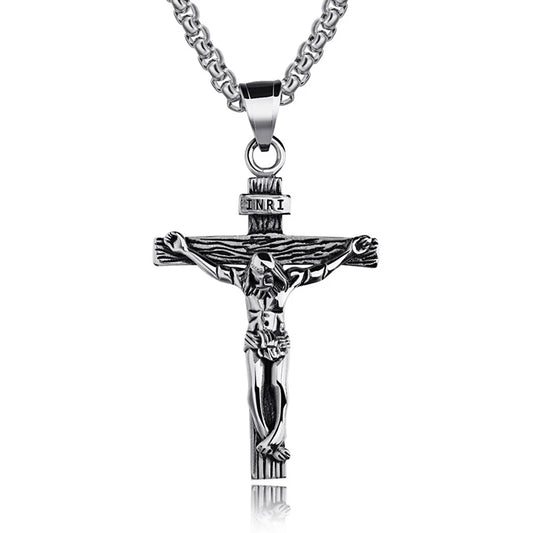 Silver crucifix pendant necklace on a white background