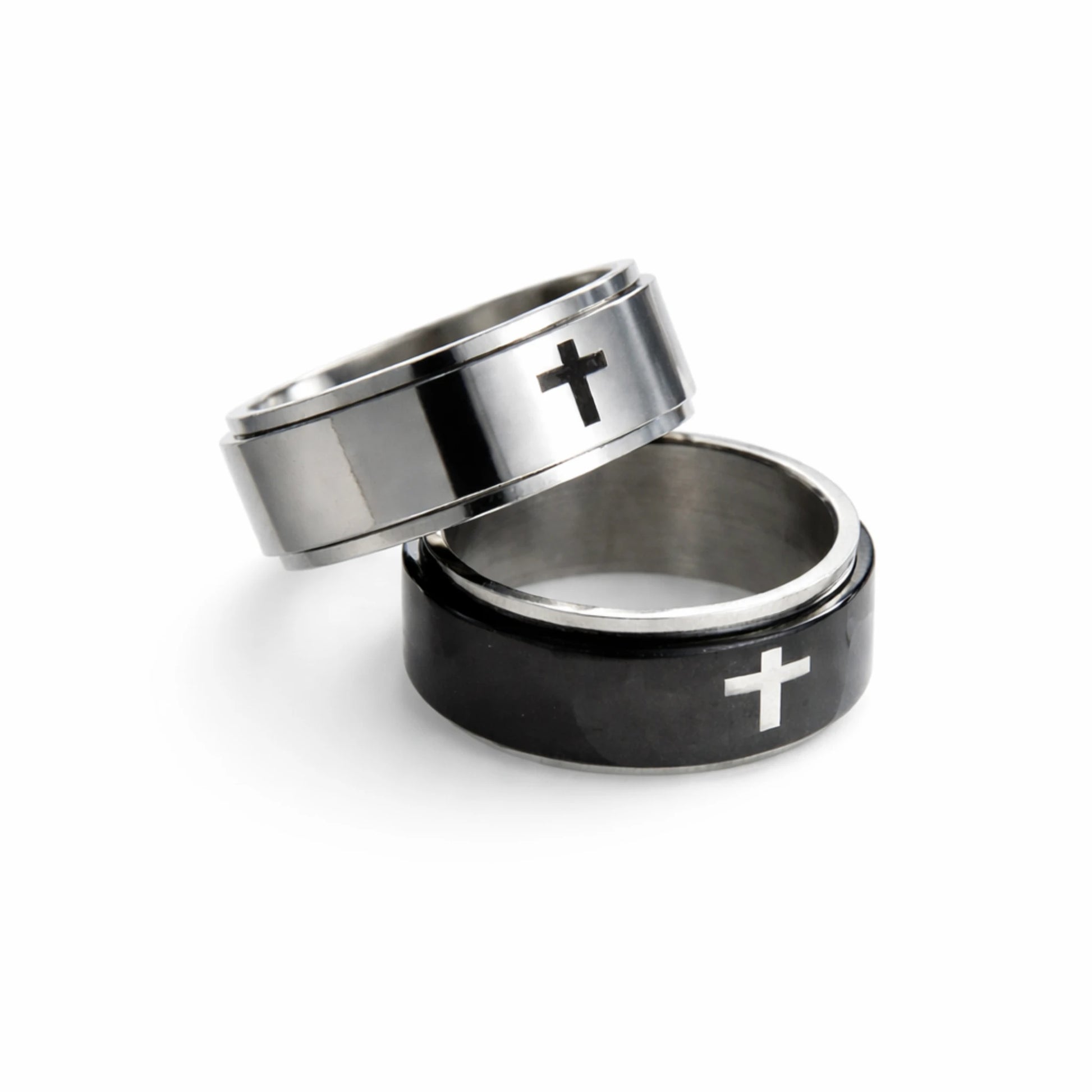 Two rings with cross designs on a white background