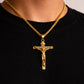 Gold crucifix necklace on a black shirt