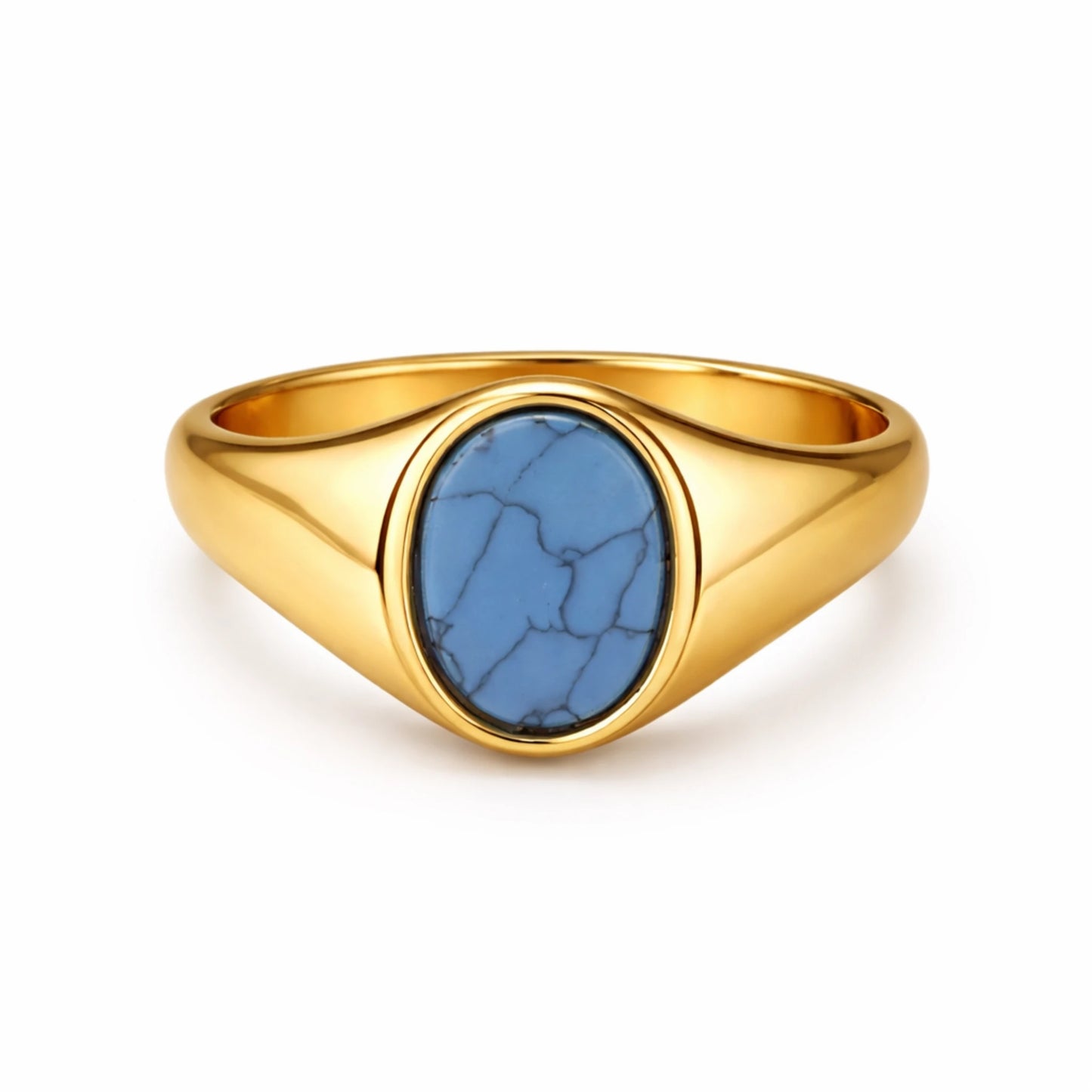 Gold ring with a blue stone on a white background