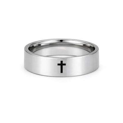 Silver ring with a black cross on a white background