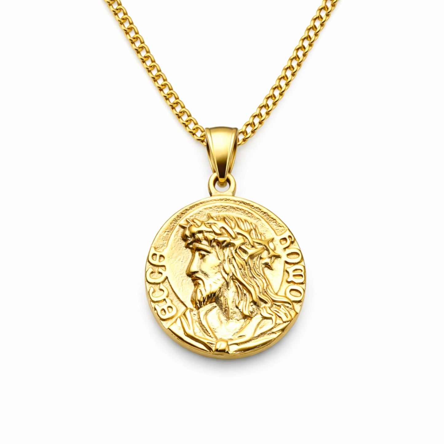 Gold necklace with a pendant featuring a face design on a white background