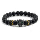Black beaded bracelet with a detailed black panther head charm on a white background
