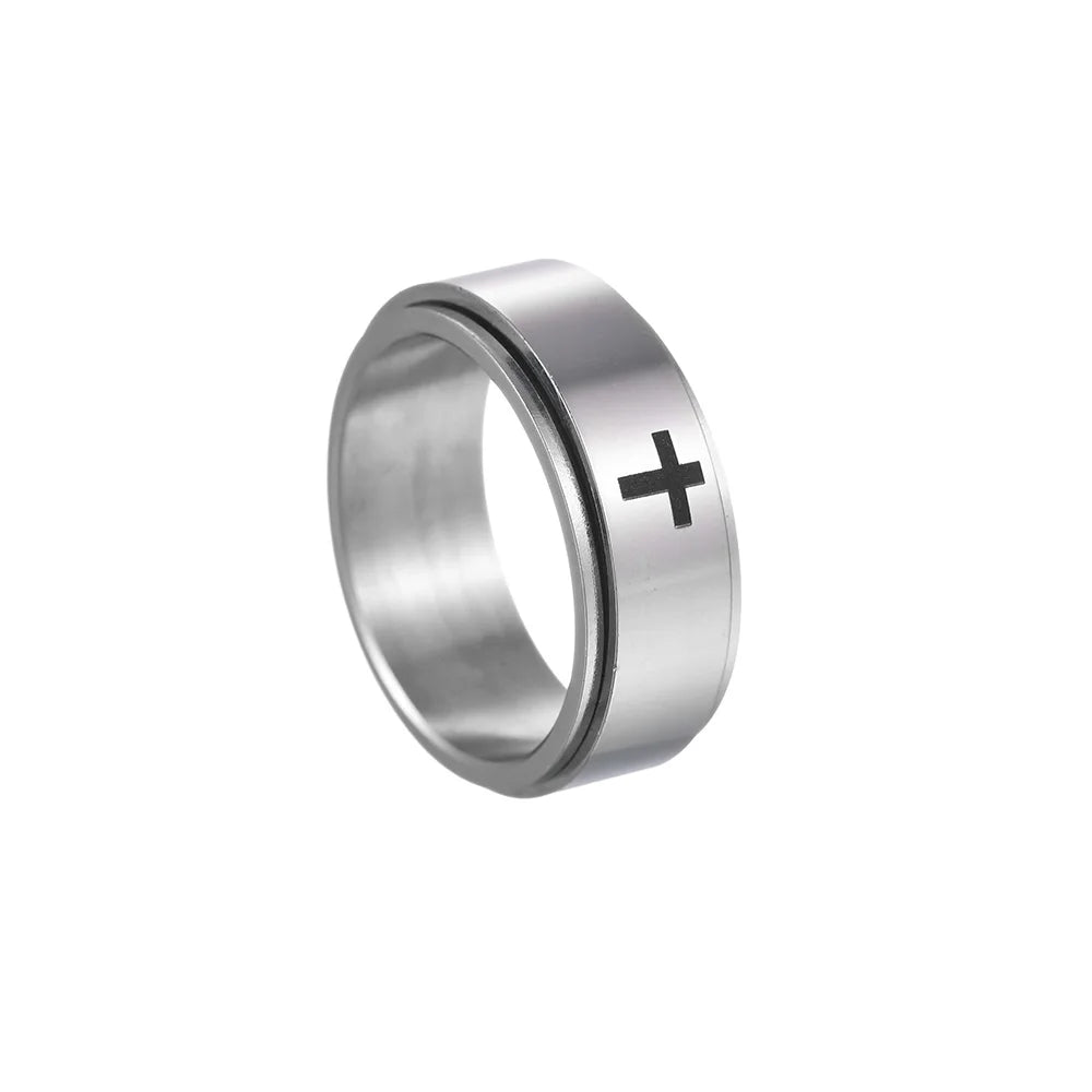 Silver ring with a black cross on a white background