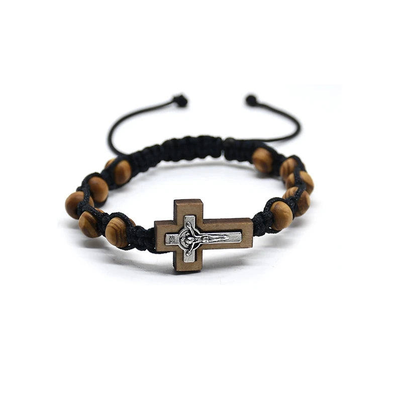 Bracelet with wooden beads and a cross charm on a white background