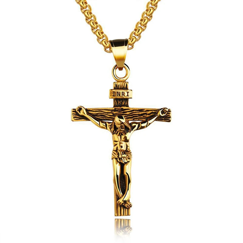 Gold crucifix pendant on a white background